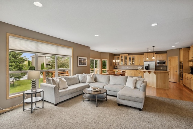 15807 Martin St NW, Andover, MN 55304 - living area featuring recessed lighting and light colored carpet