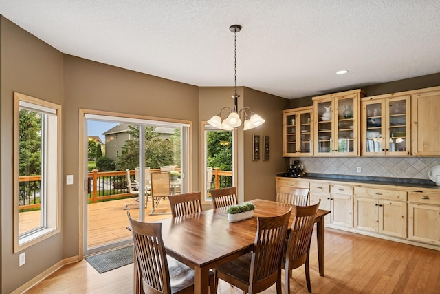 15807 Martin St NW, Andover, MN 55304 - dining space with light wood-style flooring, a chandelier, and recessed lighting