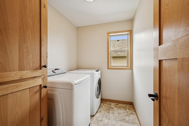 15807 Martin St NW, Andover, MN 55304 - laundry room with washer and dryer and baseboards