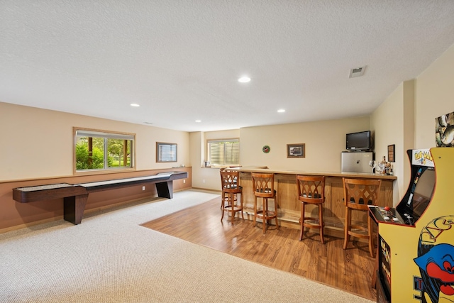 15807 Martin St NW, Andover, MN 55304 - game room with a dry bar, carpet, healthy amount of natural light, recessed lighting, and a textured ceiling