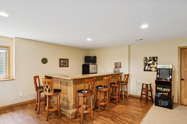 15807 Martin St NW, Andover, MN 55304 - indoor dry bar with wood finished floors and recessed lighting