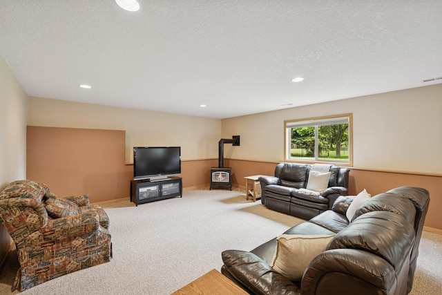 15807 Martin St NW, Andover, MN 55304 - carpeted living area featuring a wood stove and recessed lighting