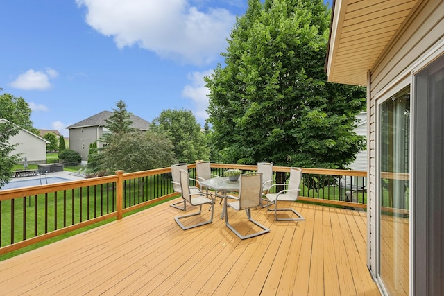 15807 Martin St NW, Andover, MN 55304 - wooden terrace with outdoor dining area and a lawn