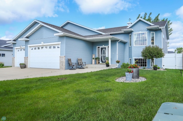 4450 48th St S, Fargo, ND 58104 - view of front of house with a garage, driveway, and a shingled roof