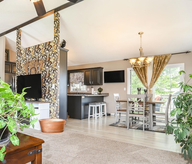 4450 48th St S, Fargo, ND 58104 - dining space with a chandelier and light colored carpet