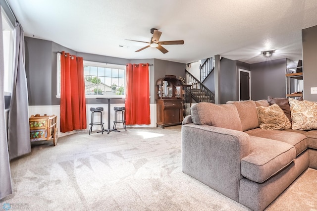 4450 48th St S, Fargo, ND 58104 - carpeted living room with a ceiling fan and stairs