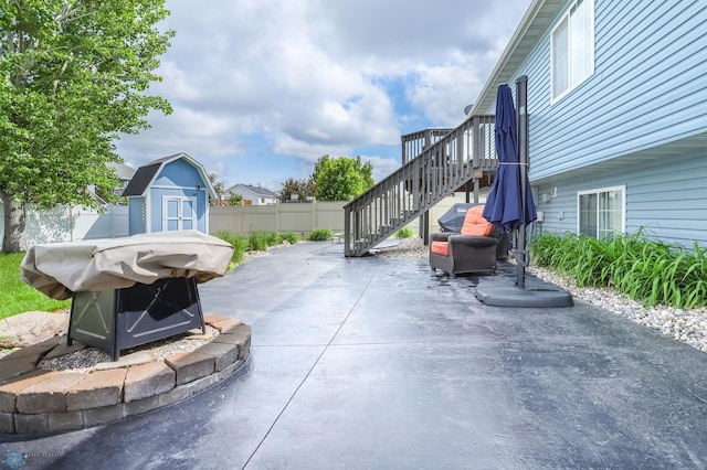 4450 48th St S, Fargo, ND 58104 - view of patio / terrace with a shed and stairway