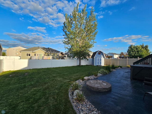 4450 48th St S, Fargo, ND 58104 - fenced backyard featuring a shed, a patio area, a residential view, and a fire pit