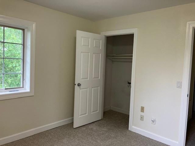 34358 State Highway 18, Finlayson Twp, MN 55735 - unfurnished bedroom featuring multiple windows, carpet floors, and a closet