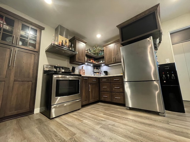 546 6th St S, Greenbush, MN 56726 - kitchen featuring appliances with stainless steel finishes, open shelves, light wood-style flooring, dark brown cabinets, and light countertops