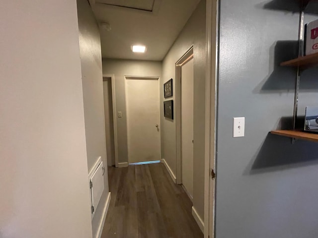 546 6th St S, Greenbush, MN 56726 - hallway featuring dark wood-style floors and attic access