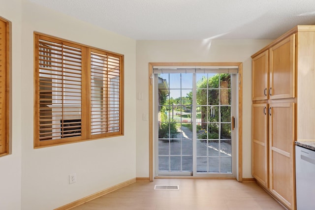 1900 Hunter Hill Rd, Hudson, WI 54016 - entryway with baseboards and a textured ceiling