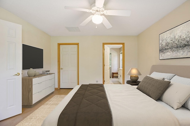 1900 Hunter Hill Rd, Hudson, WI 54016 - bedroom with light wood-style floors, a ceiling fan, and ensuite bathroom
