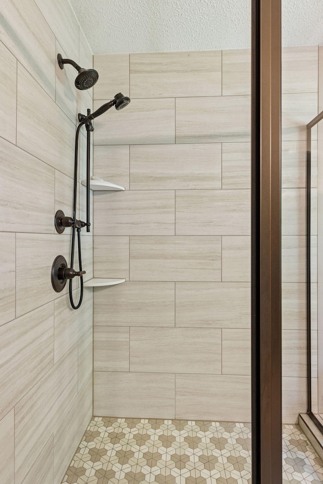 1900 Hunter Hill Rd, Hudson, WI 54016 - bathroom featuring a textured ceiling and a stall shower