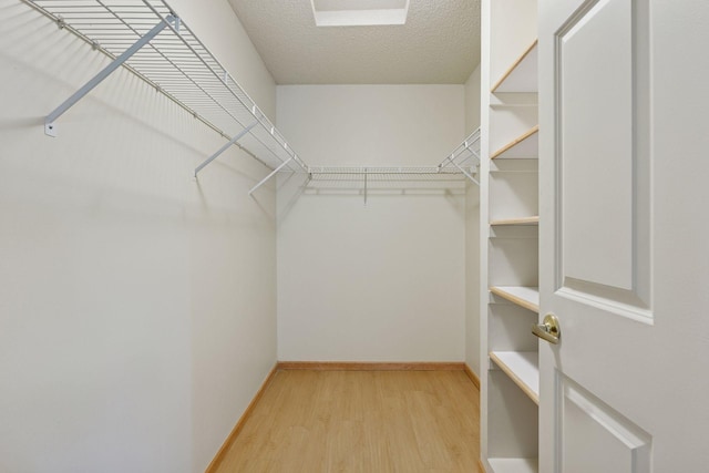 1900 Hunter Hill Rd, Hudson, WI 54016 - walk in closet featuring light wood-type flooring