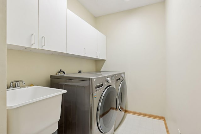 1900 Hunter Hill Rd, Hudson, WI 54016 - laundry room with cabinet space, washer and dryer, and light floors