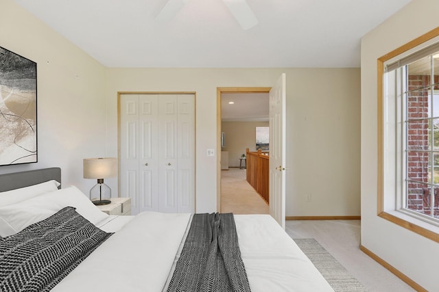 1900 Hunter Hill Rd, Hudson, WI 54016 - bedroom featuring light carpet, multiple windows, a closet, and a ceiling fan
