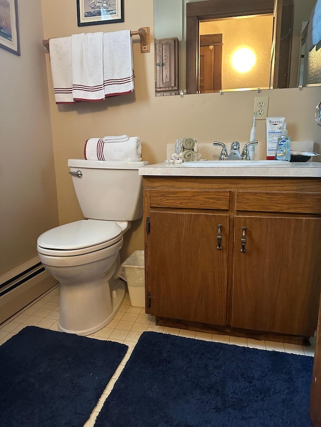 220 Woodman Ave, Dovray, MN 56125 - half bathroom featuring vanity, tile patterned floors, and a baseboard heating unit