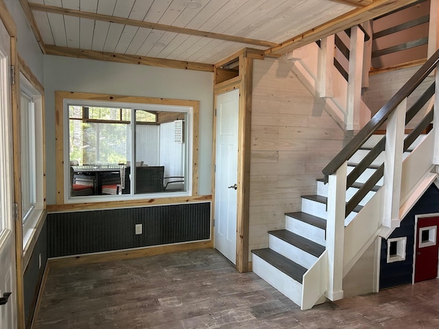 6274 Azalea Rd, Motley Twp, MN 56466 - stairs with wood walls, a wooden ceiling with exposed beams, and wood finished floors