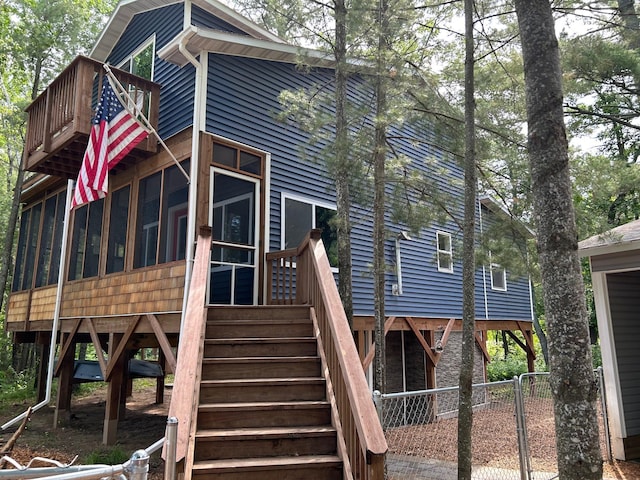 6274 Azalea Rd, Motley Twp, MN 56466 - rear view of house featuring a sunroom and stairs