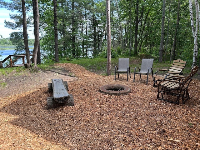 6274 Azalea Rd, Motley Twp, MN 56466 - view of yard with a fire pit and a water view