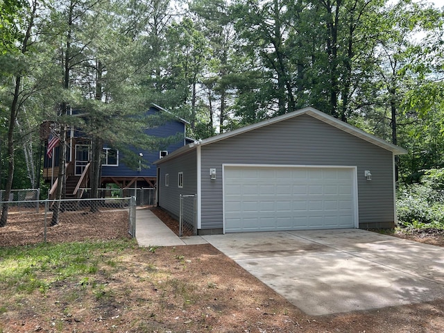 6274 Azalea Rd, Motley Twp, MN 56466 - view of front of house featuring a garage, an outbuilding, and stairway