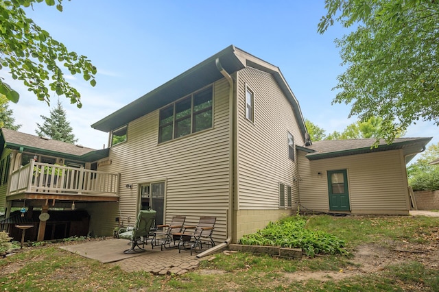 11770 N Meadow Curv, Lindstrom, MN 55045 - back of house featuring a patio and a wooden deck
