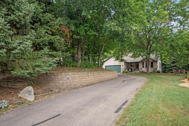 11770 N Meadow Curv, Lindstrom, MN 55045 - view of front of house with asphalt driveway, an attached garage, and a front yard