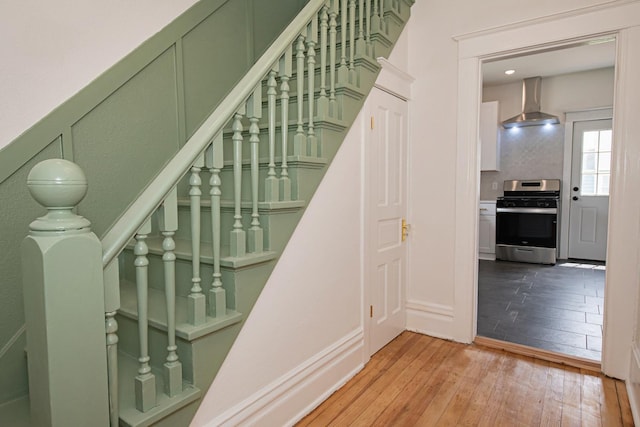 322 Jefferson St, Caledonia, MN 55921 - staircase featuring hardwood / wood-style floors