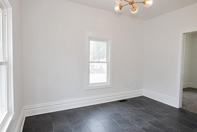 322 Jefferson St, Caledonia, MN 55921 - spare room featuring a chandelier