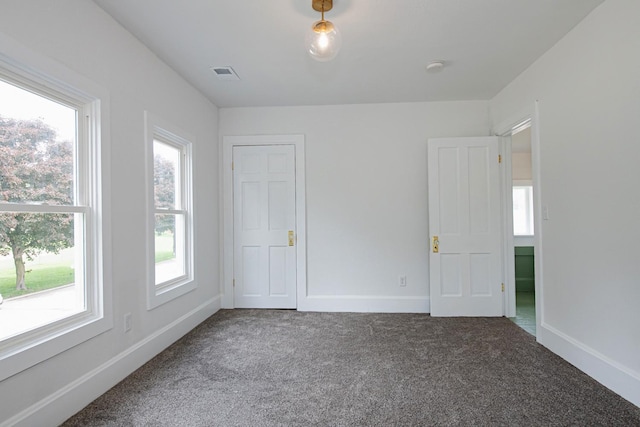 322 Jefferson St, Caledonia, MN 55921 - unfurnished bedroom featuring carpet flooring and multiple windows