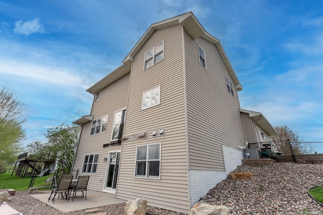 104 Sylla St, River Falls, WI 54022 - back of house featuring a patio area