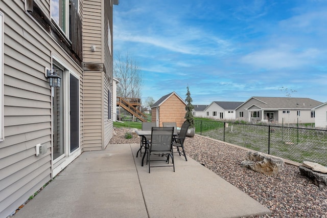 104 Sylla St, River Falls, WI 54022 - view of patio with a residential view and outdoor dining area