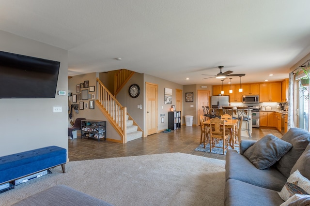 104 Sylla St, River Falls, WI 54022 - tiled living area with stairs, ceiling fan, and recessed lighting