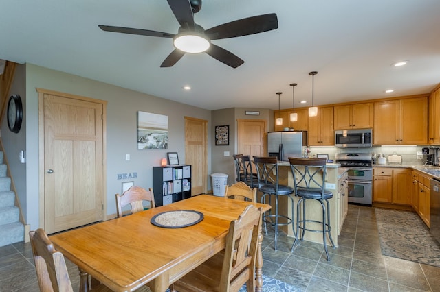 104 Sylla St, River Falls, WI 54022 - dining area featuring recessed lighting, a ceiling fan, stairway, and dark stone finish floors