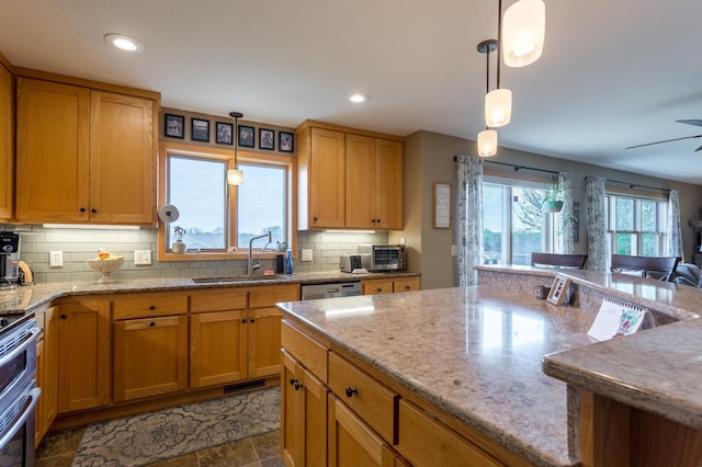 104 Sylla St, River Falls, WI 54022 - kitchen with backsplash, stainless steel range with electric cooktop, light stone countertops, hanging light fixtures, and recessed lighting