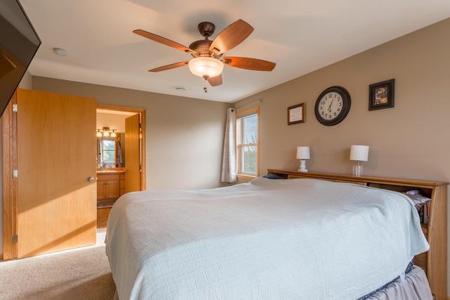 104 Sylla St, River Falls, WI 54022 - bedroom featuring ensuite bathroom, carpet flooring, and ceiling fan