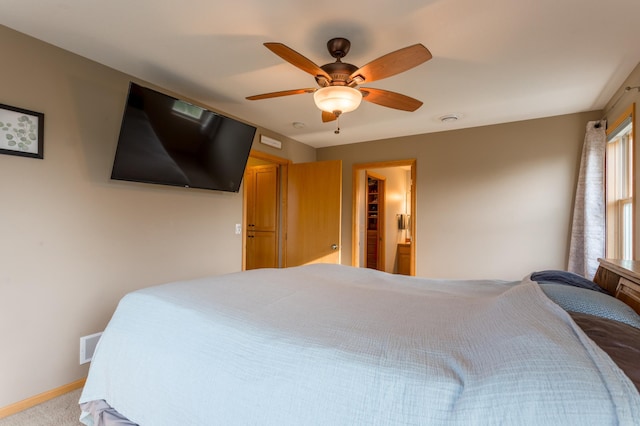 104 Sylla St, River Falls, WI 54022 - carpeted bedroom with ceiling fan and baseboards