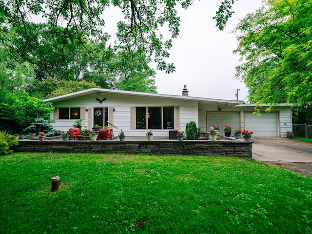 8585 Ilex Pl NW, Rice, MN 56367 - ranch-style house featuring driveway, a front lawn, a chimney, and a garage