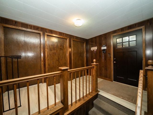 8585 Ilex Pl NW, Rice, MN 56367 - foyer entrance with wooden walls and carpet floors