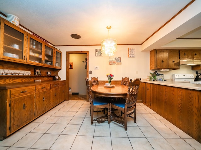 8585 Ilex Pl NW, Rice, MN 56367 - dining area with a chandelier, light tile patterned floors, and ornamental molding