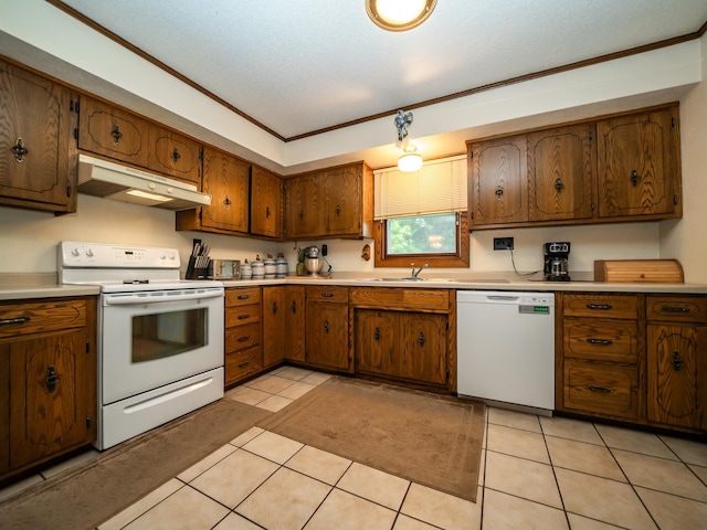 8585 Ilex Pl NW, Rice, MN 56367 - kitchen with white appliances, under cabinet range hood, light countertops, brown cabinets, and ornamental molding