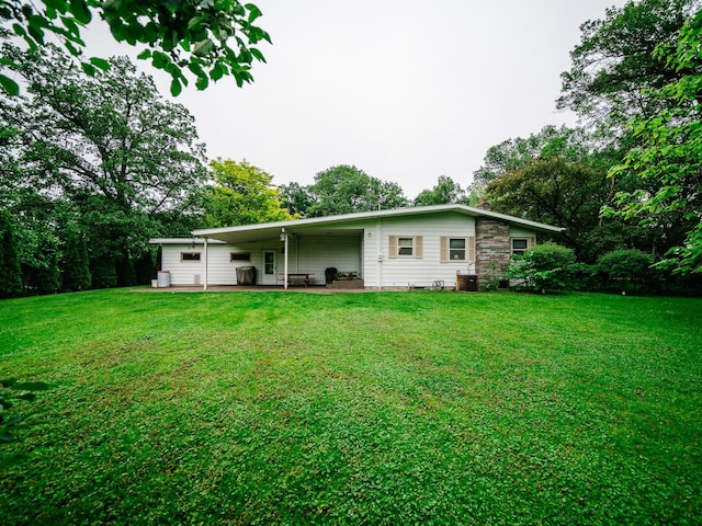 8585 Ilex Pl NW, Rice, MN 56367 - rear view of property featuring a lawn and a patio area