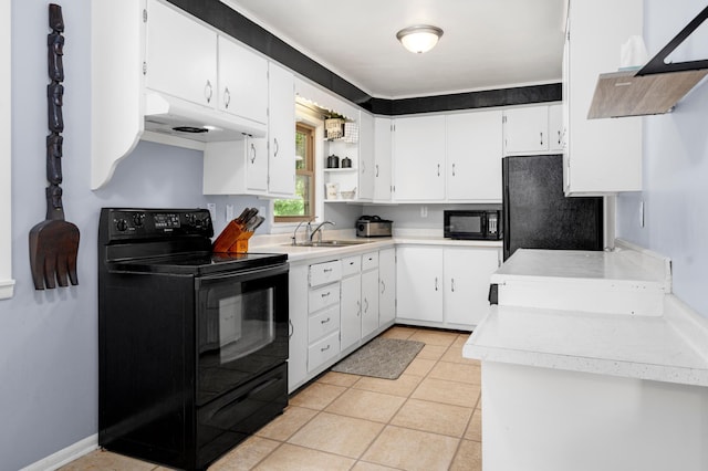 111 4th St N, Grove City, MN 56243 - kitchen with black appliances, exhaust hood, under cabinet range hood, light countertops, and white cabinetry