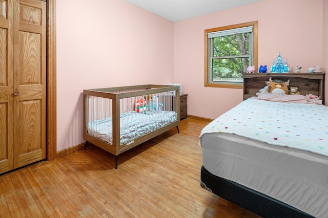 111 4th St N, Grove City, MN 56243 - bedroom featuring baseboards and light wood finished floors