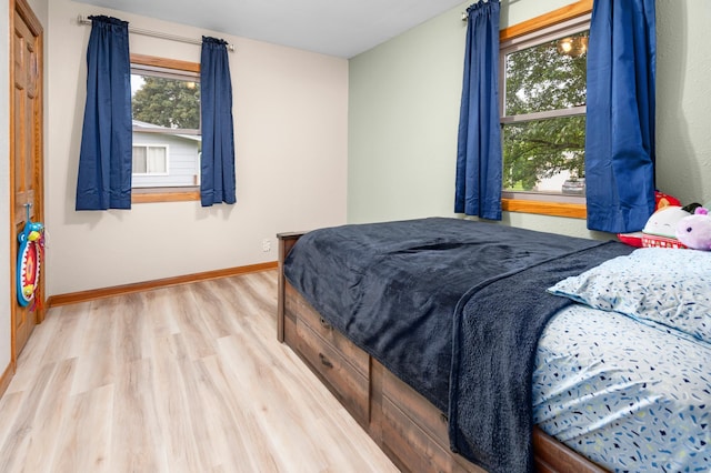 111 4th St N, Grove City, MN 56243 - bedroom featuring wood finished floors and baseboards