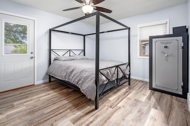 111 4th St N, Grove City, MN 56243 - bedroom with light wood-style flooring and a ceiling fan