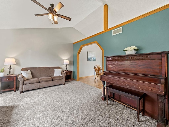 6735 378th St, North Branch, MN 55056 - living area with carpet floors, vaulted ceiling, ceiling fan, and arched walkways