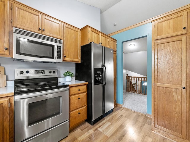 6735 378th St, North Branch, MN 55056 - kitchen with stainless steel appliances, light wood-type flooring, and light countertops
