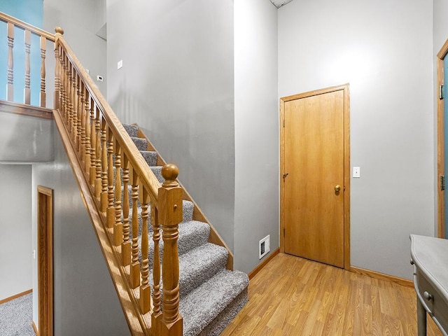 6735 378th St, North Branch, MN 55056 - foyer entrance featuring light wood-style floors, a towering ceiling, and stairway